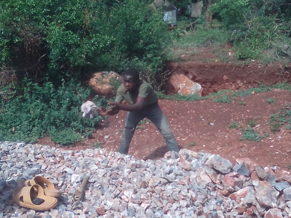 Charles Ouma, a Moi University student. He was forced to halt his academic journey in 2016 due to lack of school fees. He has been crushing stones for concrete, with his father, in a bid to raise the required amount, but all in vain. PHOTO/Gilbert Ochieng, The Scholar Media Africa.