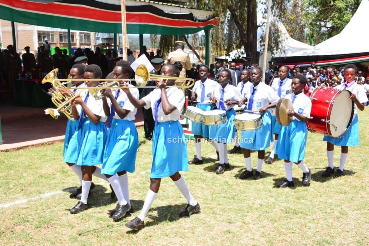 Solian Girls leading the Koibatek Sub-County Police parade match during the Mashujaa Day celebrations. The young girls led the delegates on the way to the venue, with songs and melody. PHOTO/Janet Kiriswo, The Scholar Media Africa.