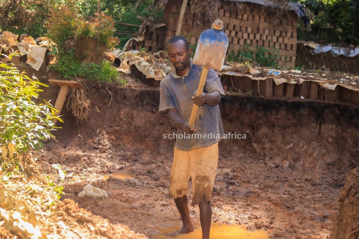 Zachary Masaki busy with his brick making activities at Tente village. PHOTO/Arnold Ageta, The Scholar Media Africa.