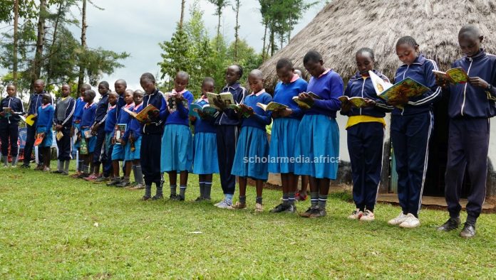Learners from Kabirirsang primary school in Kilibwoni ward, Embwen Constituency, Nandi County, interact with the learning materials after visiting the Kabirirsang community library. PHOTO/Edmond Kipngeno, The Scholar Media Africa.