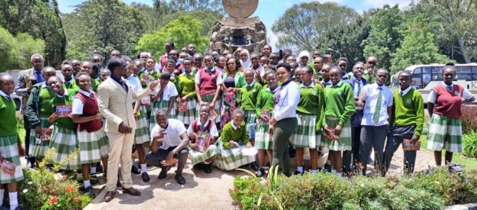 Mr. Bonface Otieno (L), Ms. Ruth Gitonga, Kabarak University staff members, and St. Andrews Tarabete Creative Writers and Book Club members after an inspiring creative writing workshop at Kabarak University last year. PHOTO/File.