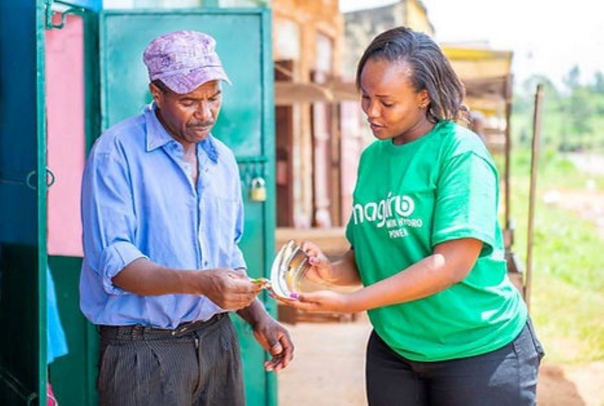 Magiro Power Project staff chatting with a client in Murang'a. PHOTO/Courtesy.