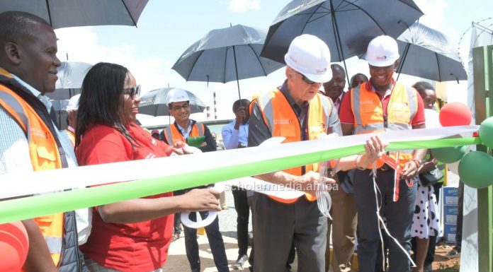 Sasini Group adopting green energy, phasing out electricity use Sasini PLC Chairman Mr. Jim McFie cutting the ribbon to commision the Kipkebe Solar Power Project during the event. PHOTO/Dan Nyamanga, The Scholar Media Africa.