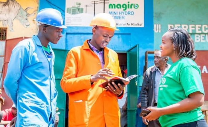 Staff John Magiro (center), the founder and CEO of Magiro Power, chatting with staff. PHOTO/Courtesy.
