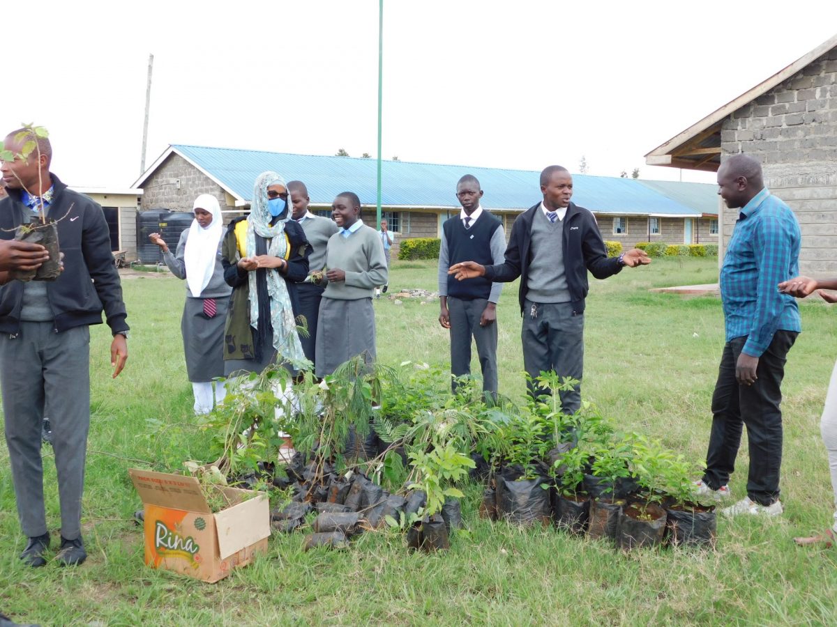 Students from Oloosirkon Secondary school, (neighbouring Nairobi National Park) taking part in a tree planting activity organized by GRECOP in partnership with MNO Advocates. PHTO/Courtesy.