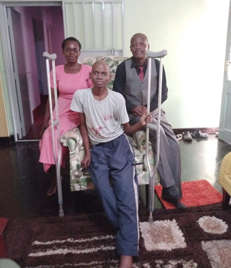 Machera poses for a photo with a cancer-battling boy in Kisumu after visiting him for encouragement. PHOTO/Courtesy.