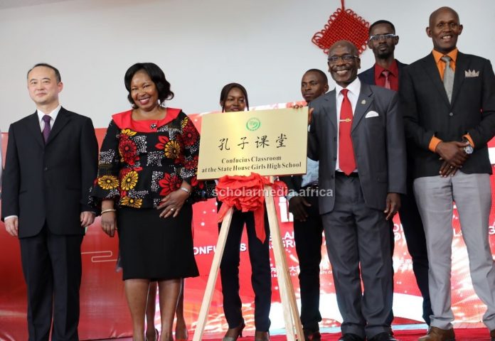 Left: Mr. Zhao Xiyuan, chargé d'affaires at the Chinese Embassy in Kenya, Mrs. Evelyn Nabukwesi, Chief Principal, State House Girls High School, Prof. Julius Ogeng’o, Deputy Vice Chancellor, Academic Affairs at UoN and other guests pose for a group photo during the launch of Confucius Classroom on March 15, 2023 at State House Girls High School. PHOTO/Tebby Otieno, Scholar Media Africa.