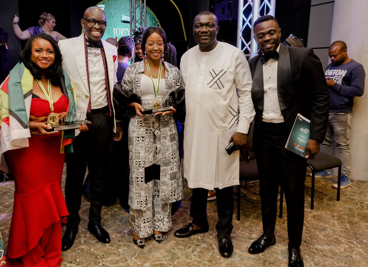 Kris Senanu (second left) and Richard Abbey (second right), having a lens moment with some of the delegates. PHOTO/Xodus Comms. 
