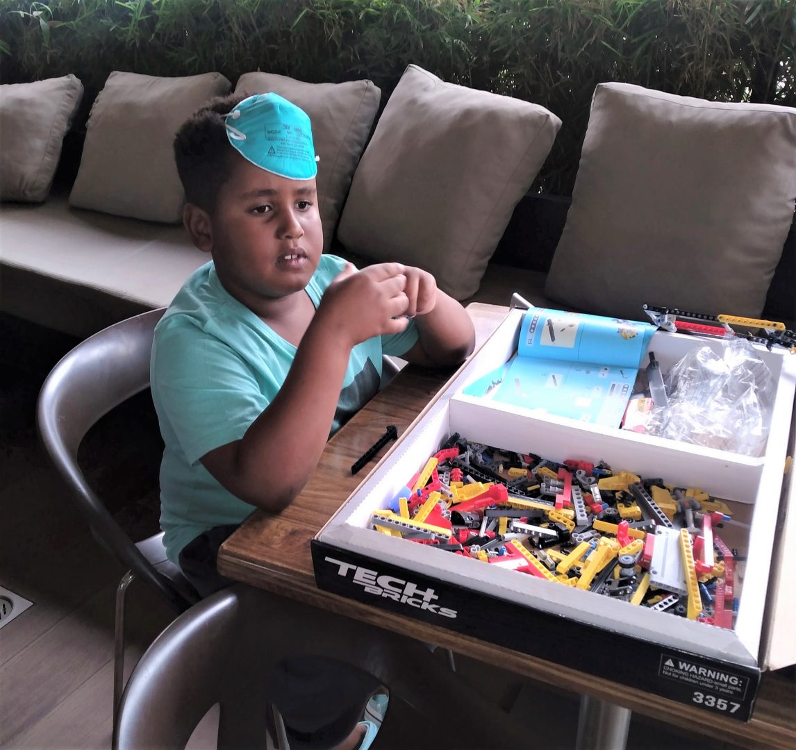 With his Tech Bricks Legos kit, brainstorming on what to build next. PHOTO/Courtesy.
