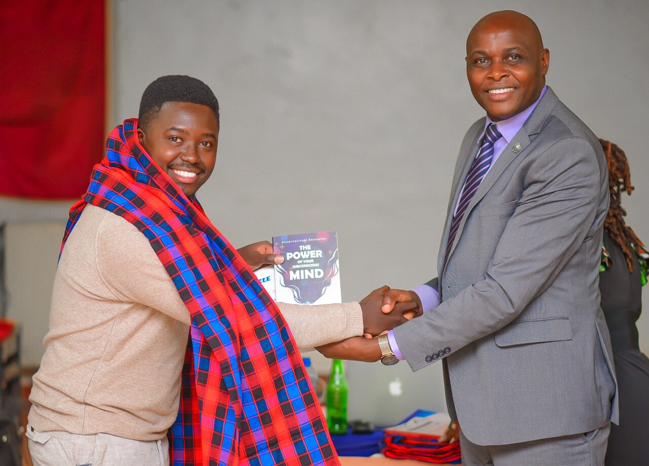 Kibagendi being gifted and certified by Dr. Okibo. PHOTO/Arise Circle. 