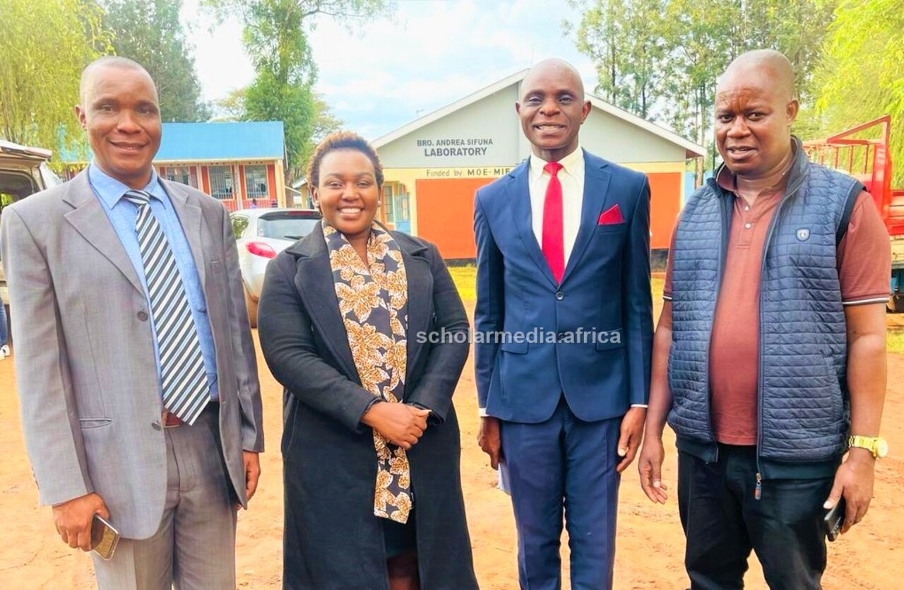 From left: Mr. Kajwang Onyango, Senior Principal St. Patrick's Secondary School Mosocho; Edinah Kangwana, Parents Association Chairperson and an alumnae of the school; Macheneri Paul, Deputy Principal and Edward Obwocha, an alumna of the school, pose for a photo before start of the celebrations. PHOTO/Benvictor Makau, Scholar Media Africa. 