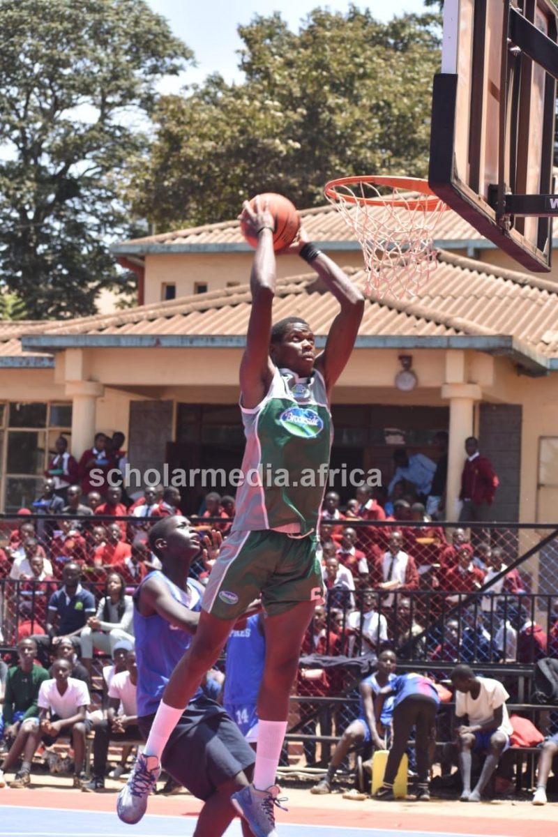 Dave Mapey of Dagoretti High goes for the dunk against Moi Forces Academy during a game at Dagoretti High School. PHOTO/Tebby Otieno, Scholar Media Africa.