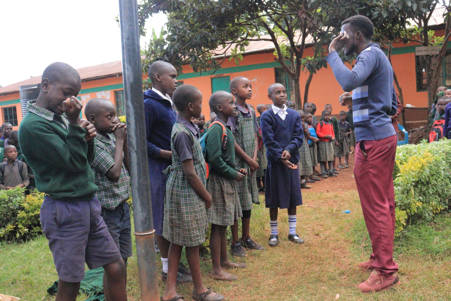 Paul Isendi, one of the team members, Having a word with Bobaracho DOK Primary school in Kisii County. PHOTO/Courtesy.