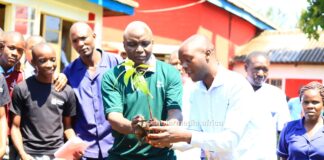 NEMA keen to make Cardinal Otunga a model school curbing climate change Albert Ombiro (in green T-Shirt), Chief Principal Cardinal Otunga High, leads teachers and students in a tree planting session at the school's grounds on July 17, 2023. The event was led by NEMA. PHOTO/Nehemiah Josephat, Scholar Media Africa.