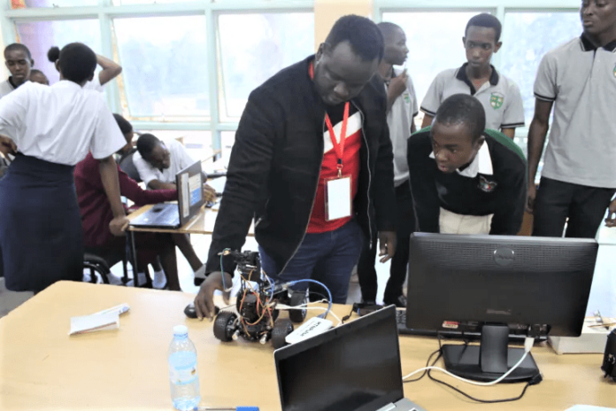 A member of the Uganda Christian University (UCU) Robotics team exhibits one of UCU’s homemade robots to Ntare High School students. Young learners needs more and regular exposure to technology-sensitive skills to equip them for the changing world. PHOTO/Irene Nyapendi. A member of the Uganda Christian University (UCU) Robotics team exhibits one of UCU’s homemade robots to Ntare High School students. Young learners needs more and regular exposure to technology-sensitive skills to equip them for the changing world. PHOTO/Irene Nyapendi.