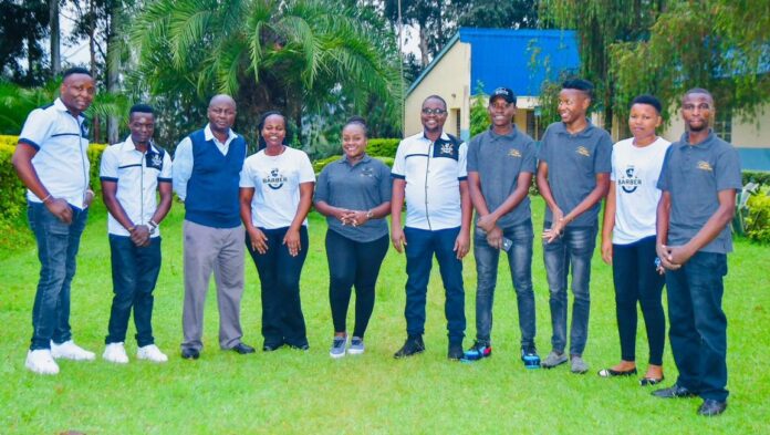 Kisii-based Finer Nails and Barber Shop team, led by Dr. Edna Orina (fifth from left), a Consultant Radiologist at Kisii Teaching and Referral Hospital, pose for a photo with Joseph Ondieki (third left), Manager, Kisii Vocational Rehabilitation Center, during their visit to the rehabilitation facility for a CSR on October 10, 2023. PHOTO/Courtesy.