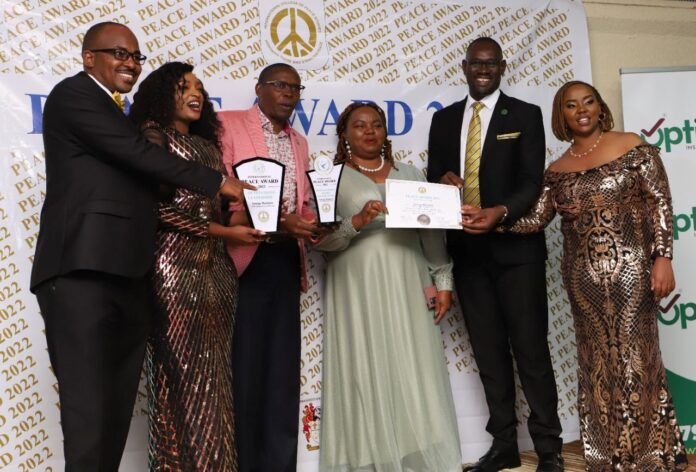 Some of the 2022 Peace Award recipients pose for a group photo after being accoladed last year. This year's event will see change agents from over 45 countries be awarded for their impact in promoting peace and other related developments in different categories. PHOTO/International College of Peace Studies (ICOPS).