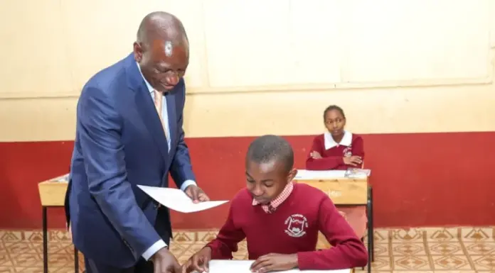 Of National Examinations: The end of an era October 30, 2023, at Kikuyu Township Primary School, Kiambu County. President William Ruto issuing exam papers to candidates during the official start of the KCPE and KPSEA National Examinations. The KCPE exams and the 8-4-4 system have come to an end, with KPSEA taking over with earnest. PHOTO/X (@WilliamsRuto)