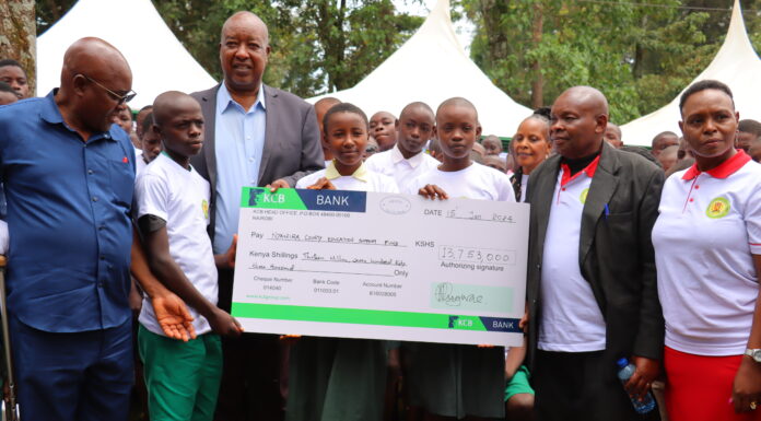 Nyamira Governor flags off beneficiaries of his sponsorship program Nyamira Governor Amos Nyaribo (second left) and CECM Education (far right) Emily Ongaga, and other county officials present a dummy cheque to the county education beneficiaries during the flagging off of the governor's sponsorship fund in Nyamira County on January 15, 2023. PHOTO/Dan Nyamanga, Scholar Media Africa.