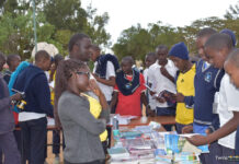 Toroitich Yegon’s relentless pursuit of success Patrick Yegon (next to the lady in specs) engaging with students in his mentorship and book tour at GG Rumuruti Boys High School. PHOTO/Janet Kiriswo, Scholar Media Africa.